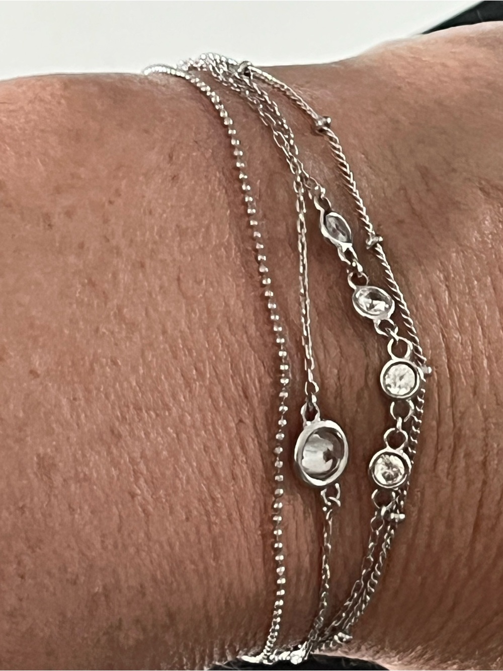 Stunning silver tone Kendra Scott multi strand bracelet with bezel set cz’s.